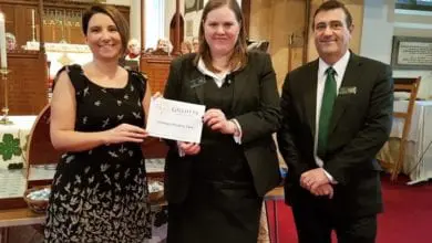 Funeral firm hands over £2,000 charity cheque
