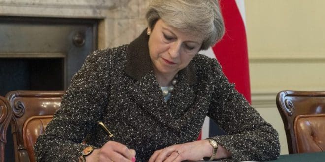 Theresa May signs letter to formally begin Brexit process