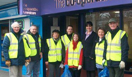 Funeral home staff clean up in community