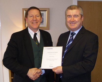 Robert Morgan receives his award Paisley funeral director receives Long Service Award