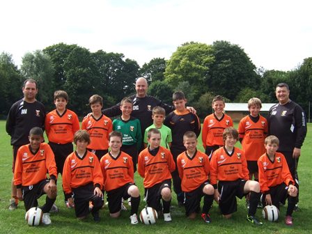 Under-12 football team score new kit